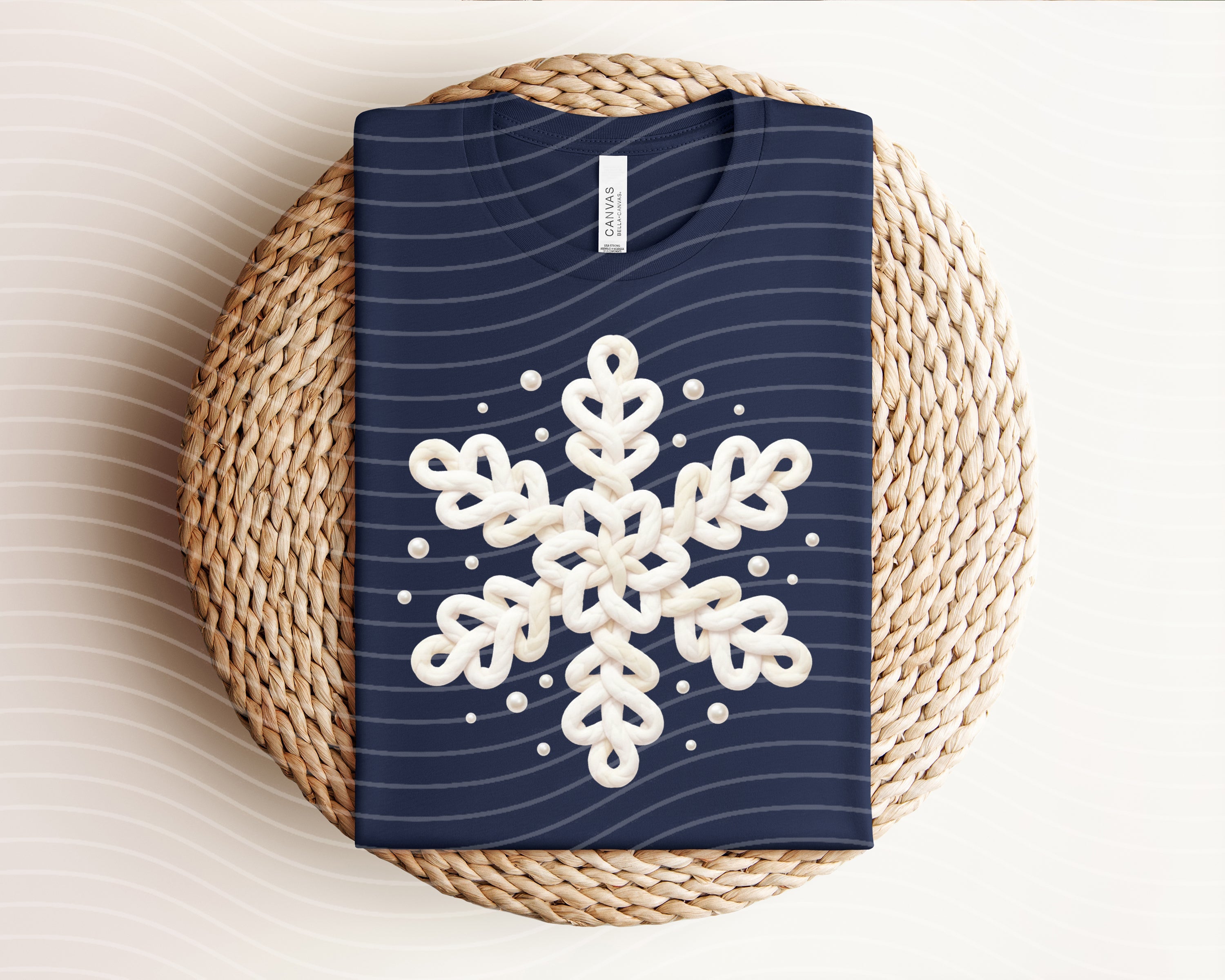 White graphic tee by Anchored Grace Boutique featuring a snowflake design on the front, casual and stylish for everyday wear.