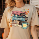 Anchored Grace Boutique Gilmore Books graphic tee featuring a colorful book-themed design on a casual cotton t-shirt.