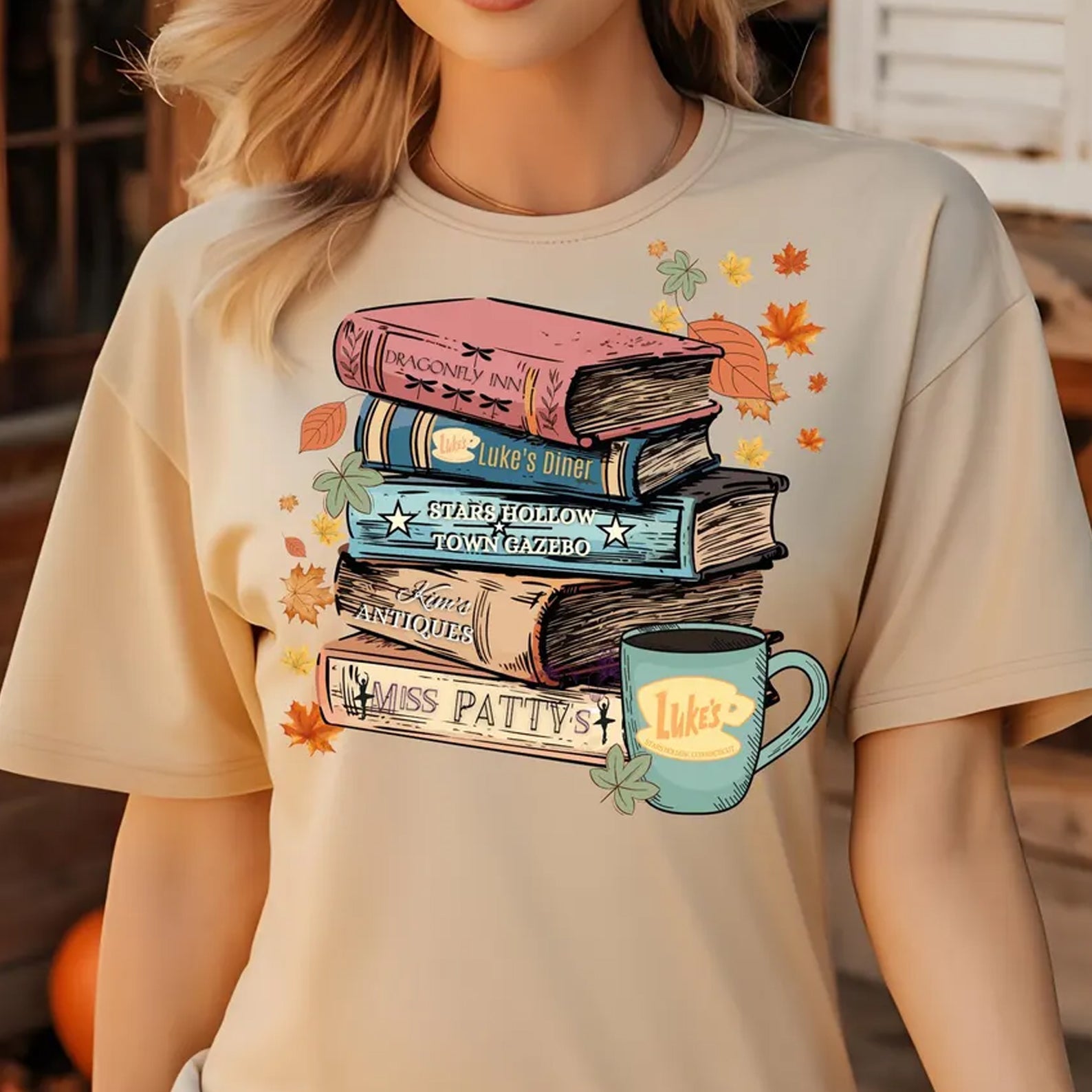 Anchored Grace Boutique Gilmore Books graphic tee featuring a colorful book-themed design on a casual cotton t-shirt.