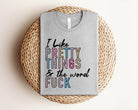 Pink graphic tee by Anchored Grace Boutique with "I Like Pretty Things" slogan, casual style, and soft fabric.