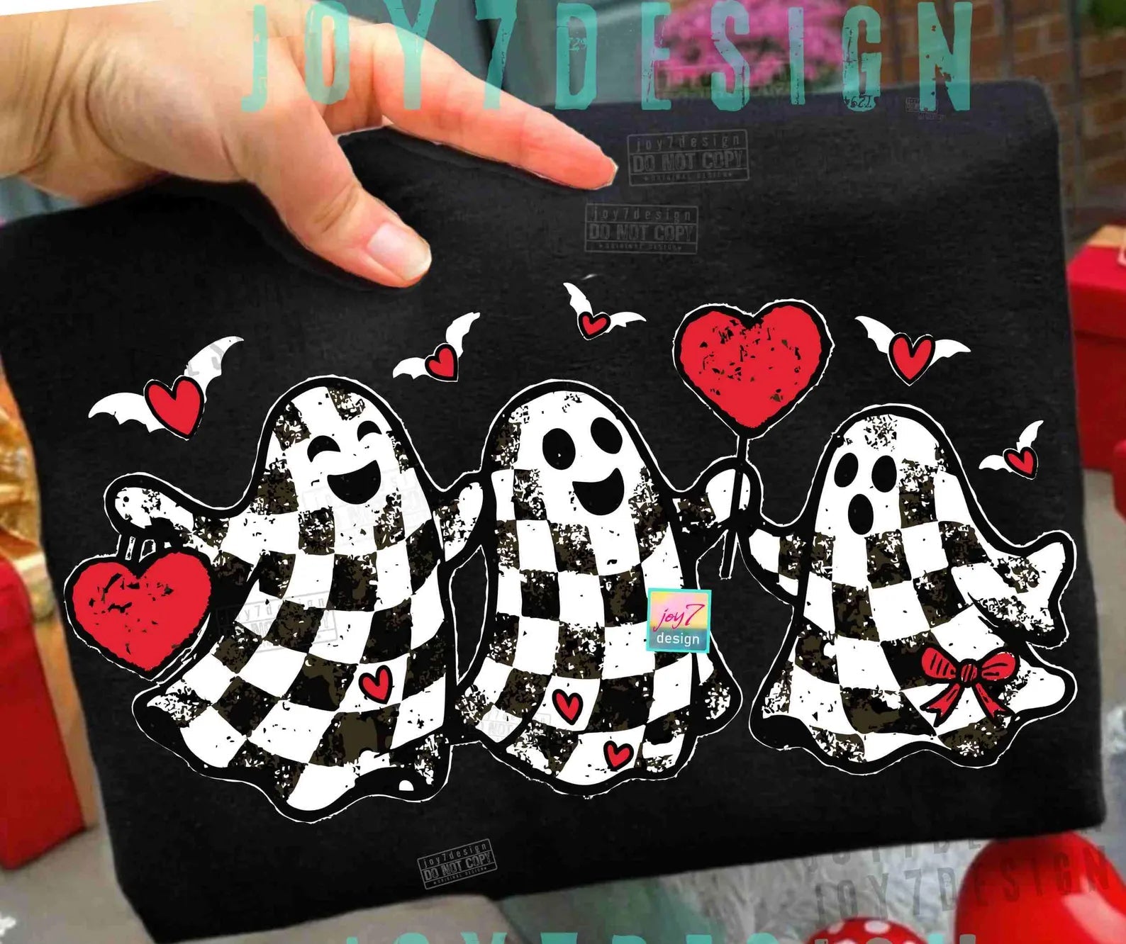 Black and white plaid ghosts graphic tee by Anchored Grace Boutique, featuring spooky ghost illustrations on a casual cotton shirt.