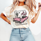 Anchored Grace Boutique graphic tee featuring a country-themed design with bold "Play Something Country" text on soft cotton fabric.