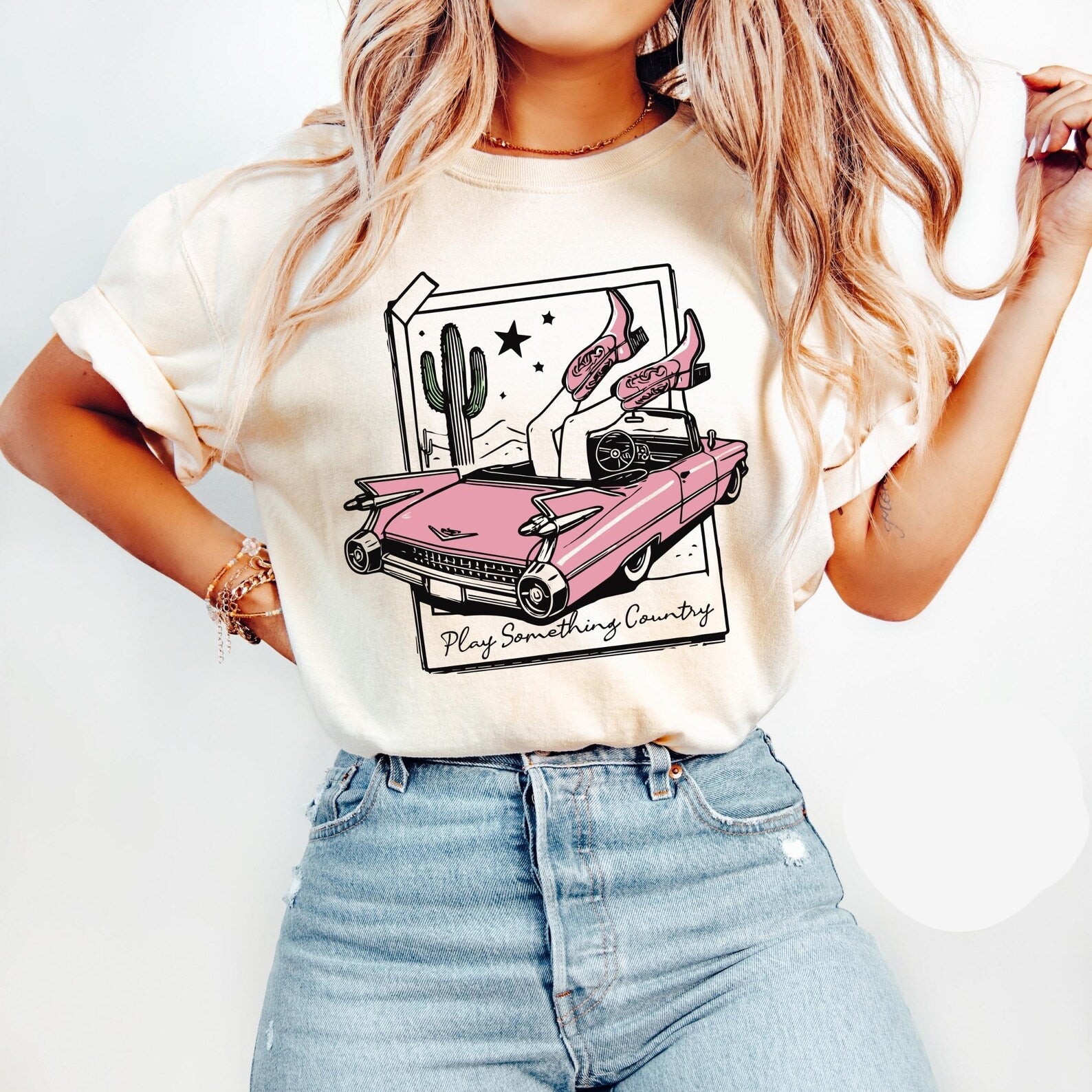 Anchored Grace Boutique graphic tee featuring a country-themed design with bold "Play Something Country" text on soft cotton fabric.