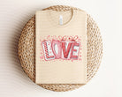 Anchored Grace Boutique Love Blocks graphic tee featuring colorful block lettering on a casual cotton t-shirt.