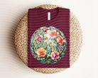 Floral stained glass graphic tee by Anchored Grace Boutique featuring vibrant floral design on a casual t-shirt.