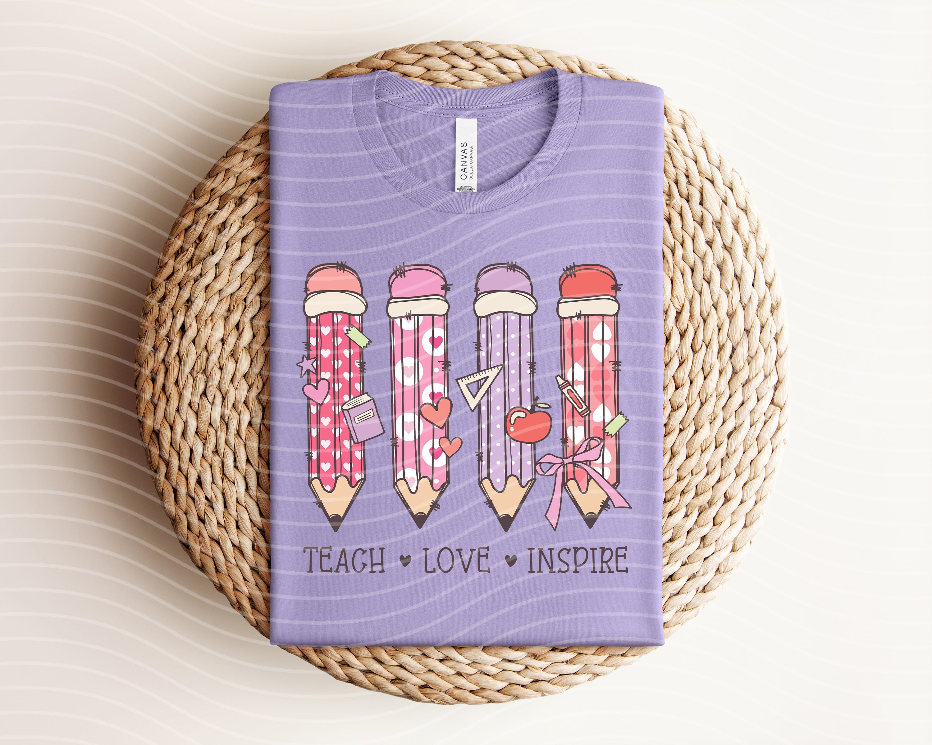 Black Teach Love Inspire graphic tee from Anchored Grace Boutique featuring inspirational text and a casual fit.