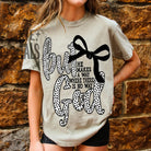 Black But God graphic tee by Anchored Grace Boutique featuring bold white text on soft cotton fabric.