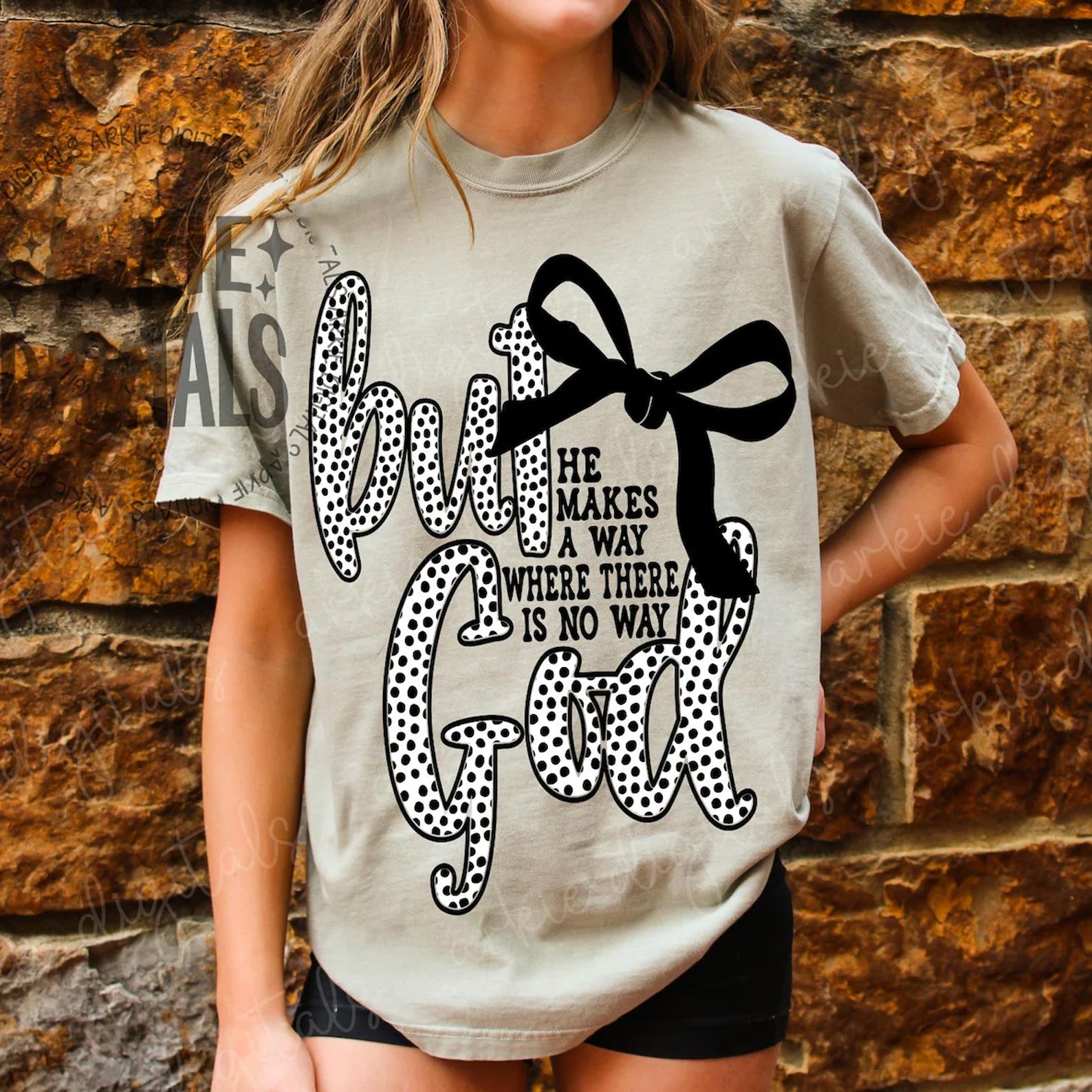 Black But God graphic tee by Anchored Grace Boutique featuring bold white text on soft cotton fabric.