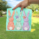 Watercolor bunnies graphic tee by Anchored Grace Boutique, featuring soft pastel bunny illustrations on a casual cotton t-shirt.