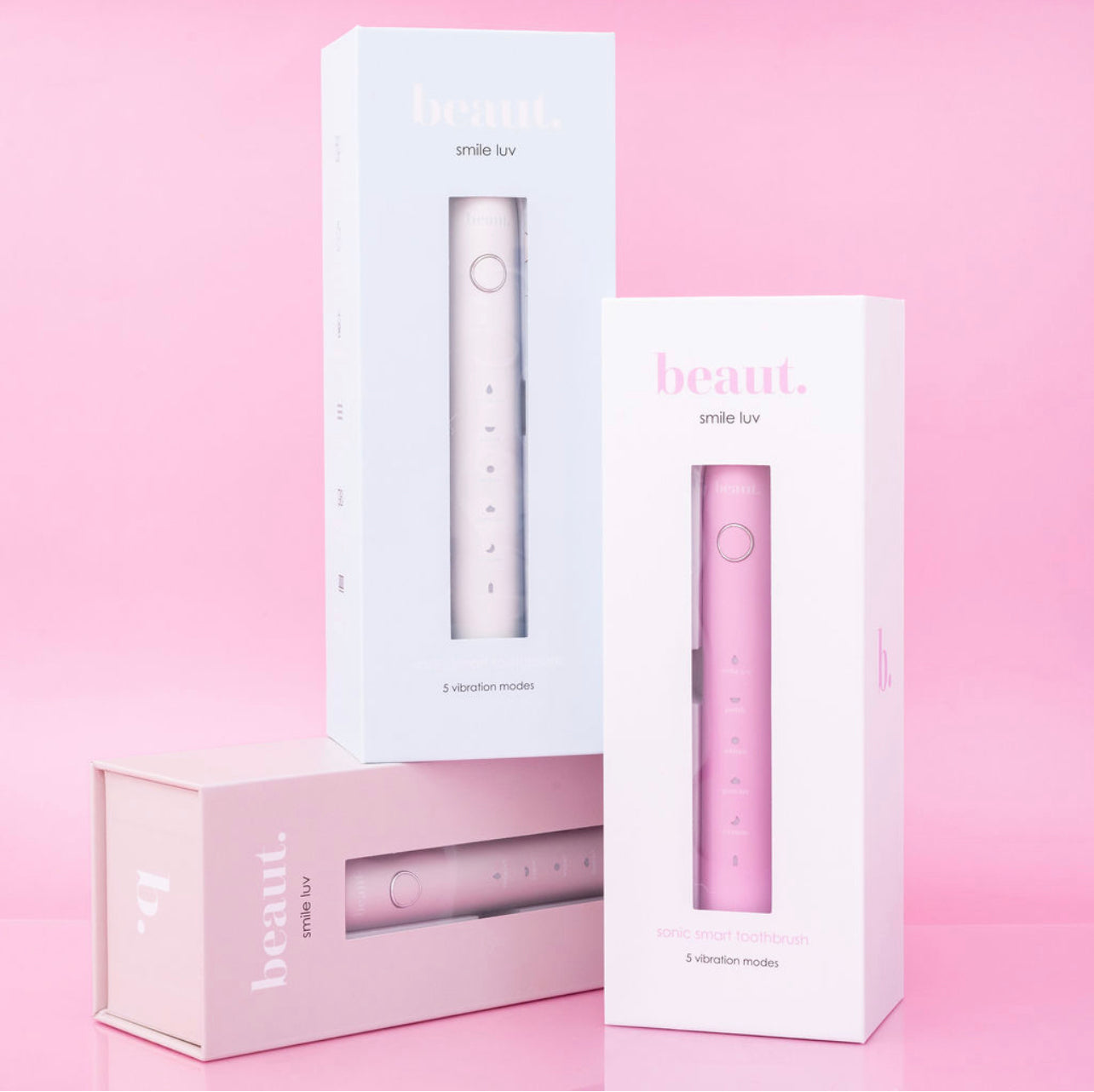 Beaut.beautyco. Smile Luv toothbrush with colorful bristles and ergonomic handle for effective teeth cleaning.
