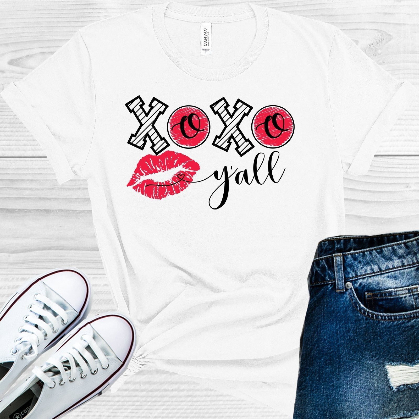 Pink XOXO Y'all Valentine's Day graphic tee by Anchored Grace Boutique, featuring a cheerful design on soft fabric.