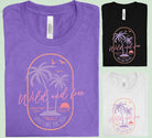 Wild and Free Just Like the Sea graphic tee from Anchored Grace Boutique featuring a beach-inspired design with ocean waves and text.