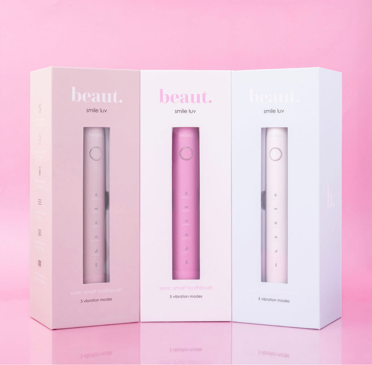 Beaut.beautyco. Smile Luv toothbrush with white handle and colorful bristles for effective oral cleaning.