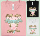 Salty Hair Sandy Toes graphic tee by Anchored Grace Boutique featuring beach-themed design and casual fit.