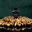 Circe Boutique Return To Sender Spell Oil in 1/2 oz bottle, featuring a dark glass container with a black and gold label.