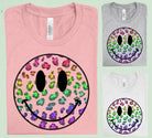 Leopard Happy Face graphic tee by Anchored Grace Boutique featuring a playful leopard face design on a casual t-shirt.