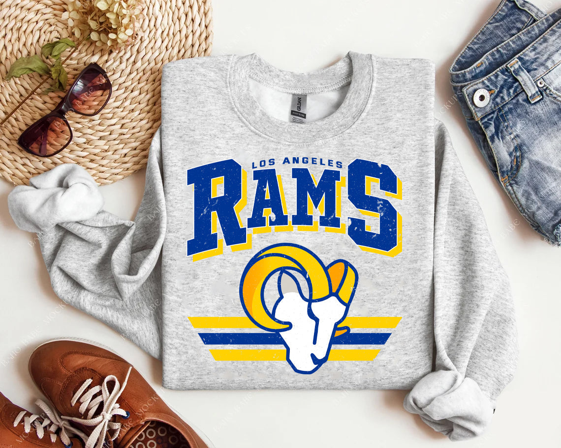 Vintage Team Rams graphic tee by Anchored Grace Boutique featuring a retro Rams logo design on soft cotton fabric.