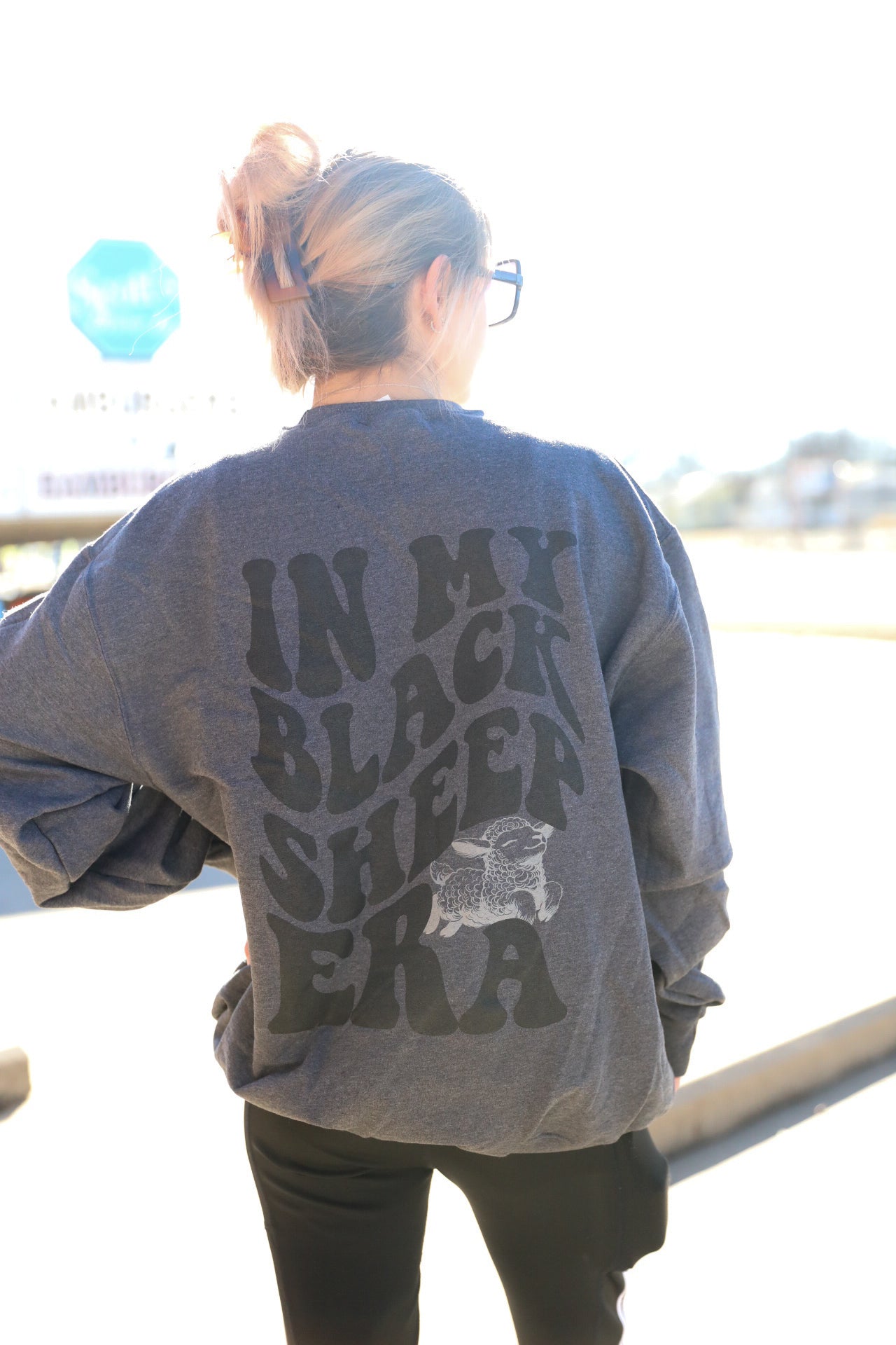 Black sheep graphic tee from Shop Karma Tees featuring a bold black sheep illustration on soft cotton fabric.