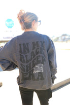 Black sheep graphic tee from Shop Karma Tees featuring a bold black sheep illustration on soft cotton fabric.