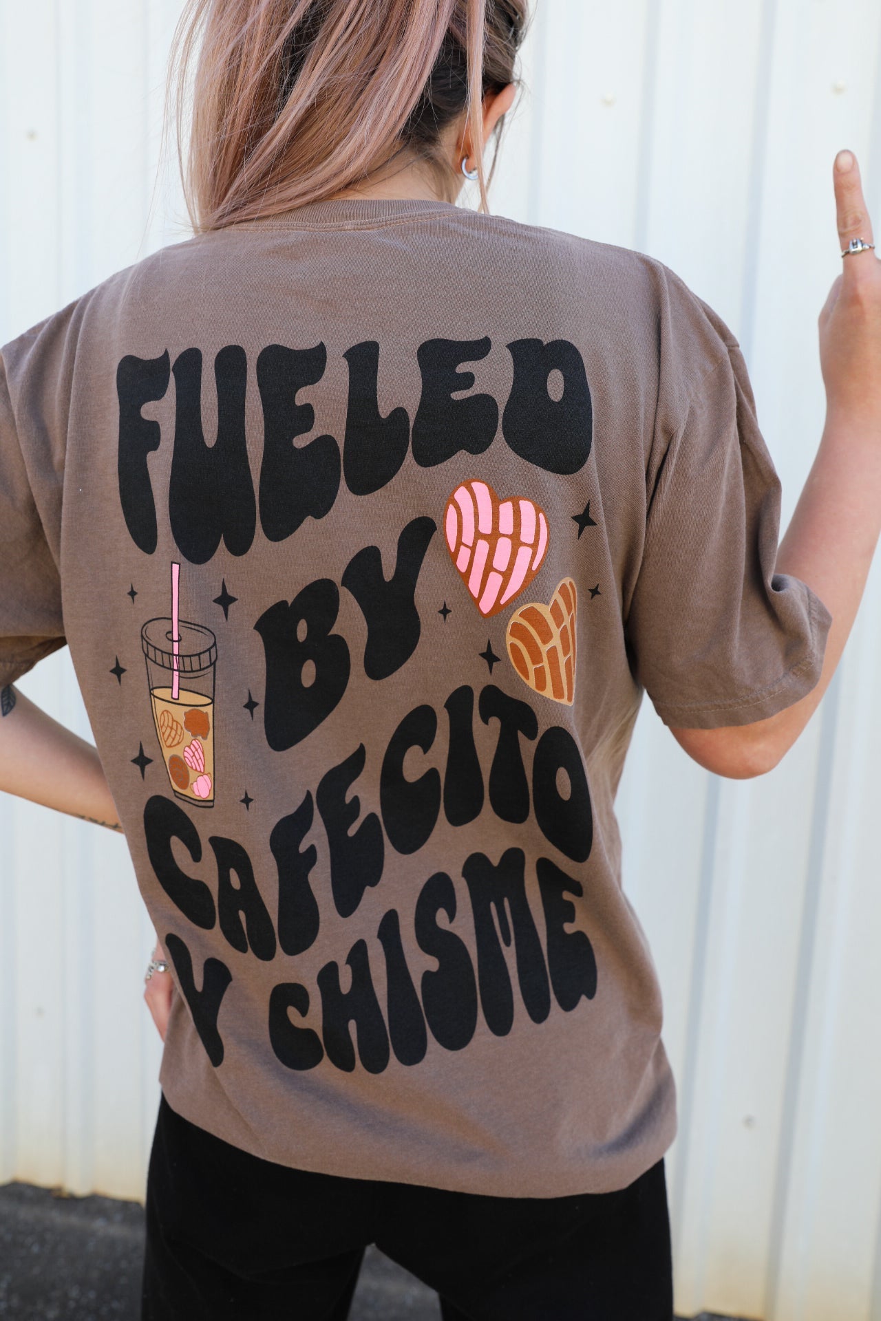 Black t-shirt with "Fueled by Cafecito Y Chisme" printed in white, casual fit, from Shop Karma Tees.