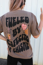 Black t-shirt with "Fueled by Cafecito Y Chisme" printed in white, casual fit, from Shop Karma Tees.