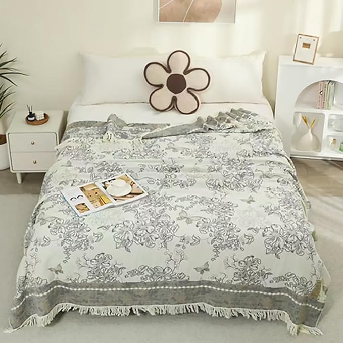 CozyNest Decor boho muslin twin-size cotton blanket with floral tassels, soft 4-layer gauze, perfect for sofa or bed decor.