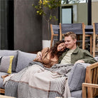 CozyNest Decor outdoor bug shield throw blanket with insect repellent, striped plaid design, lightweight for camping, picnic, or beach use.