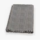 CozyNest Decor insect-repellent outdoor throw blanket with houndstooth pattern, lightweight, perfect for camping, picnics, and beach trips.