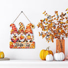 Hello Fall wooden hanging gnome decoration and rustic autumn signs for Thanksgiving, cozy home interior and exterior decor.