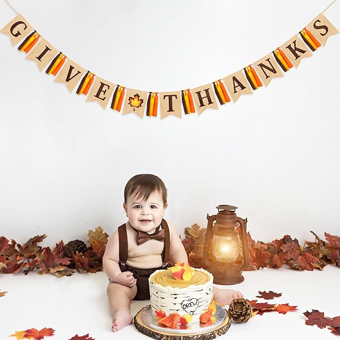 CozyNest Decor Thanksgiving banner with felt maple leaf and burlap pennants, fall ribbon, and "Give Thanks" sign for autumn celebrations.