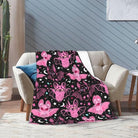 Pink CozyNest Decor fleece throw blanket for kids and adults, soft and cozy for couch, bed, or sofa decor.