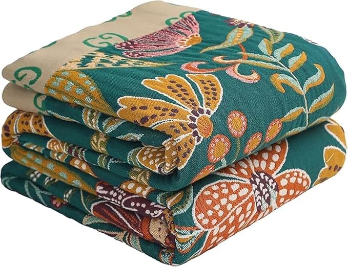 CozyNest Decor reversible cotton throw blanket with vintage bohemian floral design in yellow and green, perfect for bed or sofa.