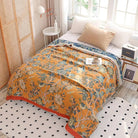 CozyNest Decor boho muslin bed blanket in floral orange, 80x90 inches, soft 4-layer cotton summer cooling coverlet for sofa or bed