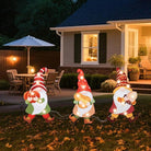 CozyNest Decor Wonder Garden 3-piece fall gnome yard signs with LED lights, pumpkins, and autumn harvest decorations for outdoor lawn and porch.