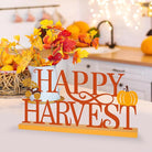 CozyNest Decor metal happy harvest sign with orange autumn leaves and pumpkin design, perfect for fall home or office decor.