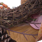 CozyNest Decor 24-inch artificial fall magnolia leaf wreath with berries, orange pinecones for door, wall, or farmhouse decor.