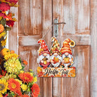 Rustic Hello Fall wood hanging gnome decoration with autumn themed wooden signs, perfect for Thanksgiving home interior and exterior decor.