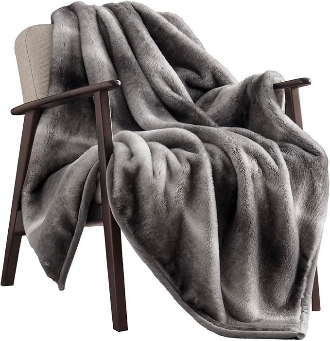 CozyNest Decor ultra soft fluffy mink faux fur throw blanket in ombré silver onyx, 50x60 inches, on a sofa for warmth and comfort.