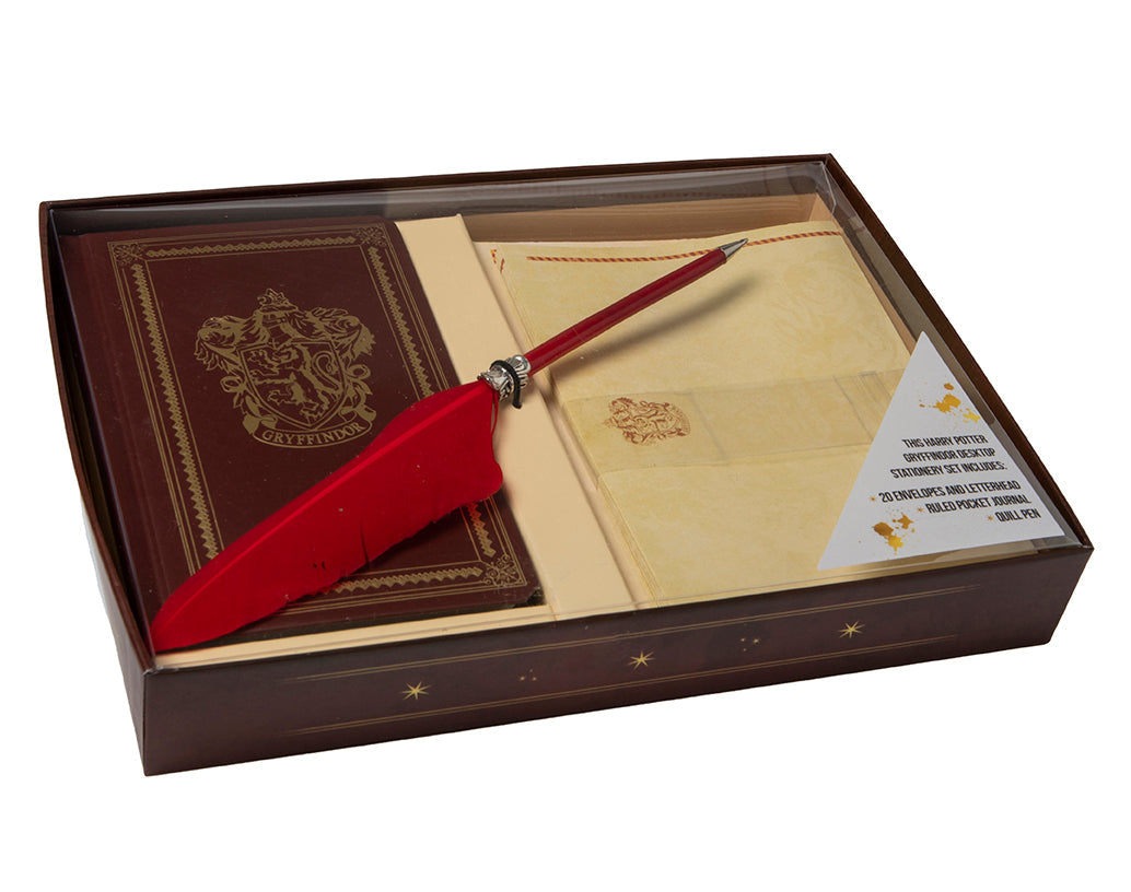 Gryffindor desktop stationery set with Harry Potter-themed notebook, pen, and accessories from Insight Editions.