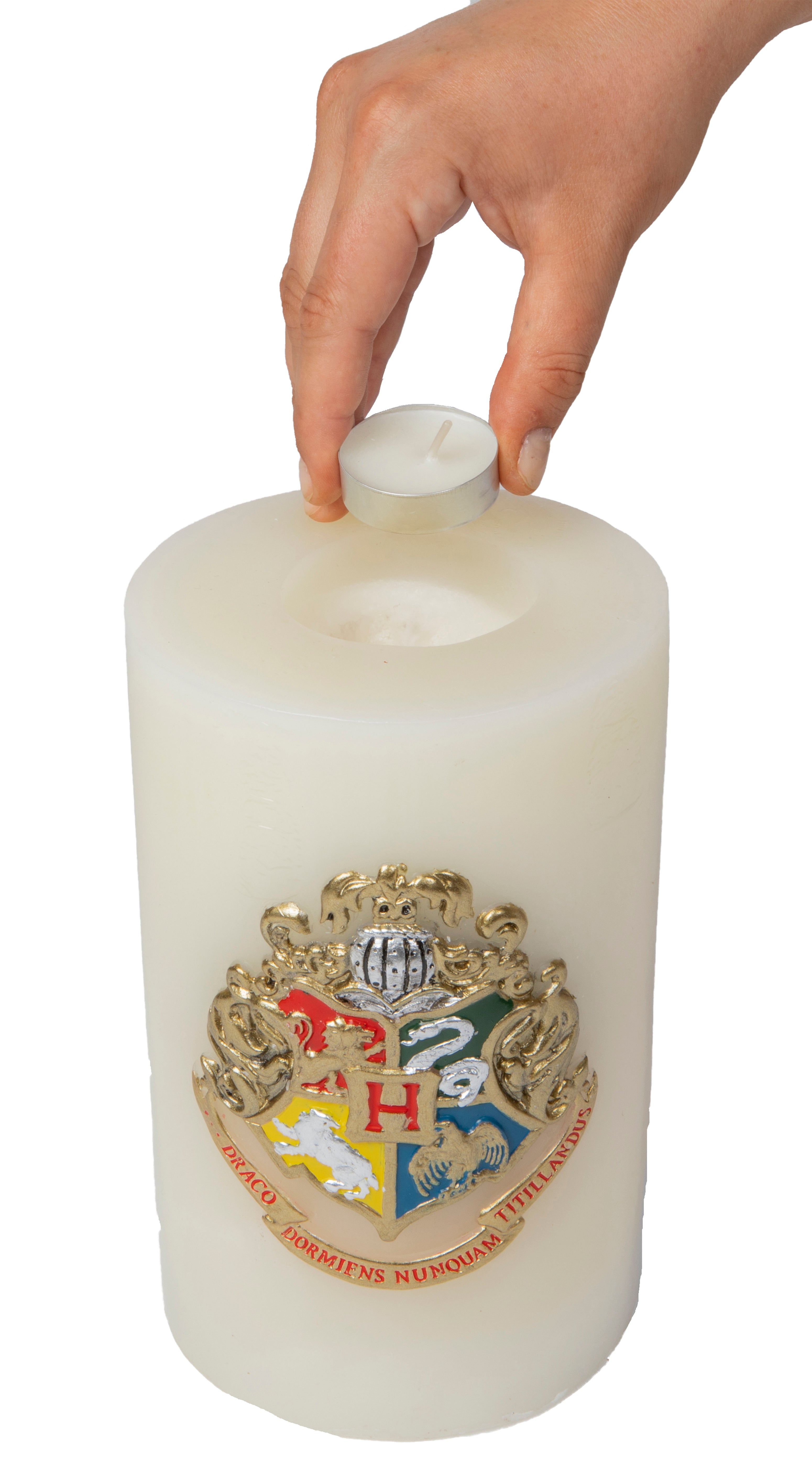 Large sculpted Hogwarts insignia candle from Harry Potter home goods by Insight Editions, featuring detailed crest design.