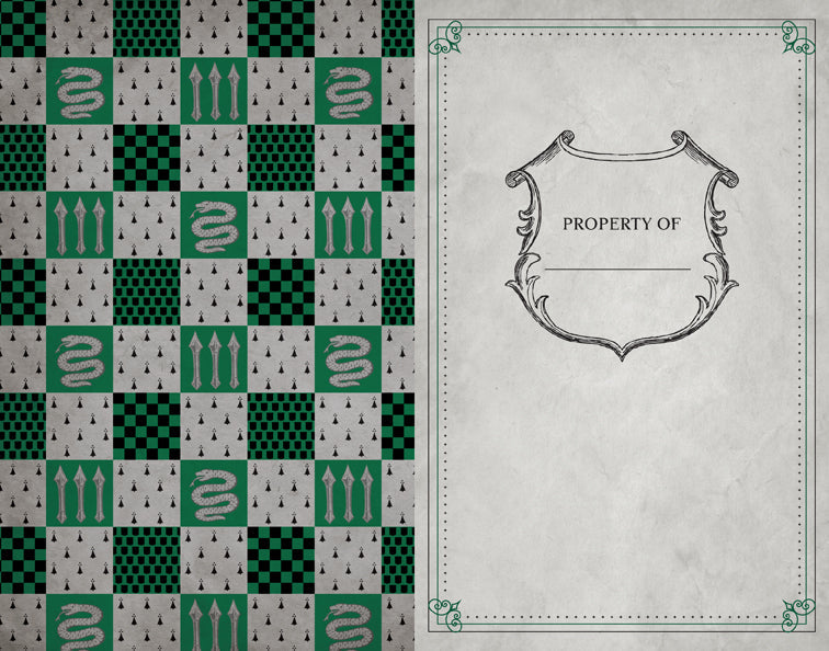 Open softcover Harry Potter Slytherin Ruled Notebook by Insight Editions showing lined pages and Slytherin-themed cover design.