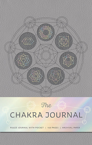 Hardcover book titled "The Seven Chakras" by Insight Editions with colorful chakra illustrations on the cover.