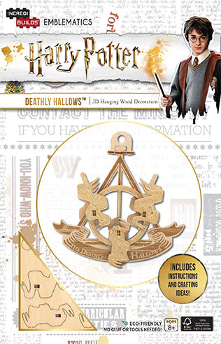 Harry Potter IncrediBuilds Emblematics Deathly Hallows kit featuring illustrated collector's box and themed stationery elements.