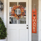 CozyNest Decor 22-inch fall eucalyptus berry wreath with rustic accents, ideal for front door or wall autumn decor.