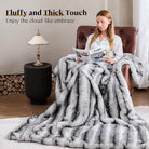 Black and white plush faux fur blanket for bed or sofa, cozy and reversible, soft thick throw from CozyNest Decor, 70x90 inches.