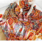Boho orange muslin blanket for adults, 80x90 inches, soft cotton with geometric floral design, cozy summer bed or sofa coverlet