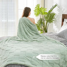CozyNest Decor quilted white faux rabbit fur throw blanket with checkered pattern, soft and fluffy for couch or bed, sage green, queen size.