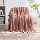CozyNest Decor MIULEE fall rust super soft throw blanket on a sofa, plush fluffy knit blanket for couch, bed, or outdoor use