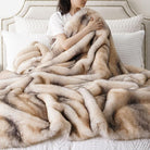 CozyNest Decor BATTILO HOME luxury faux fur throw blanket in soft mink fur, 50x60 inches, draped over a sofa for warmth and comfort.
