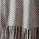 CozyNest Decor Cuddle Dreams silk throw blanket with hand-knotted fringe, herringbone gray, soft, breathable, and luxurious for cozy comfort.